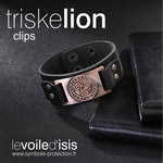 bracelet cuir noir symbole triskelion nordique cuivre fermoir clipsable posé sur table avec cahiers