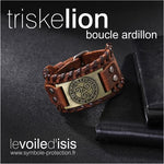 bracelet cuir marron symbole triskelion nordique or fermoir boucle posé sur table avec cahiers