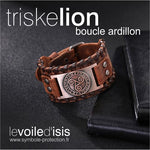 bracelet cuir marron symbole triskelion nordique cuivre fermoir boucle posé sur table avec cahiers