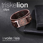 bracelet cuir marron symbole triskelion nordique Cuivre fermoir clipsable posé sur table avec cahiers
